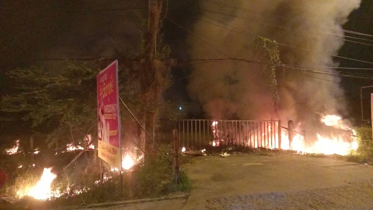 Grass fire spreads to electric pole near the express market, Ramintra, Bangkok