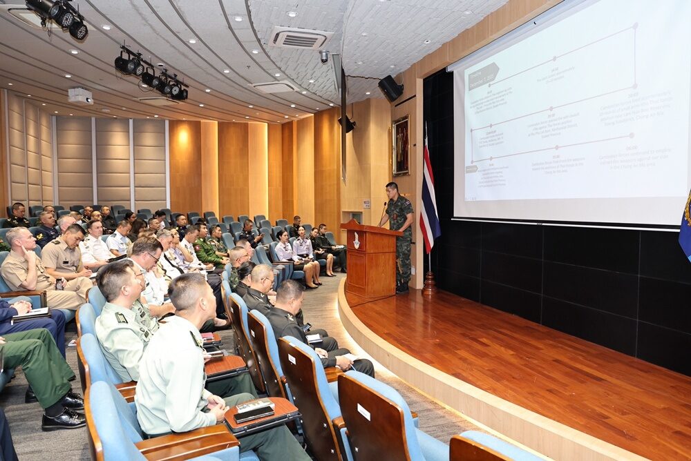 Thai Military Briefs 19 Foreign Military Attachés on Border Clashes with CambodiannOn December 9, the Thai Armed Forces briefed military attachés from 19 countries on the ongoing security situation along the Thailand–Cambodia border. The briefing, held at the Armed Forces Headquarters auditorium and chaired by General Chidchanok Nutchaya, joint chief of staff, included representatives from the Army Intelligence Department and the Ministry of Foreign Affairs. The military highlighted that Cambodian forces had initiated attacks since December 7, 2025, in Sisaket’s Kantharalak District and surrounding areas, spreading to provinces including Ubon Ratchathani, Surin, Buriram, Sa Kaeo, and Trat. The clashes have caused Thai military casualties and injuries and involved attacks on civilians, including BM-21 rocket strikes on residential areas in Buriram Province. Thai forces have responded according to engagement rules to halt the attacks, reaffirming their commitment to defending national sovereignty and territorial integrity